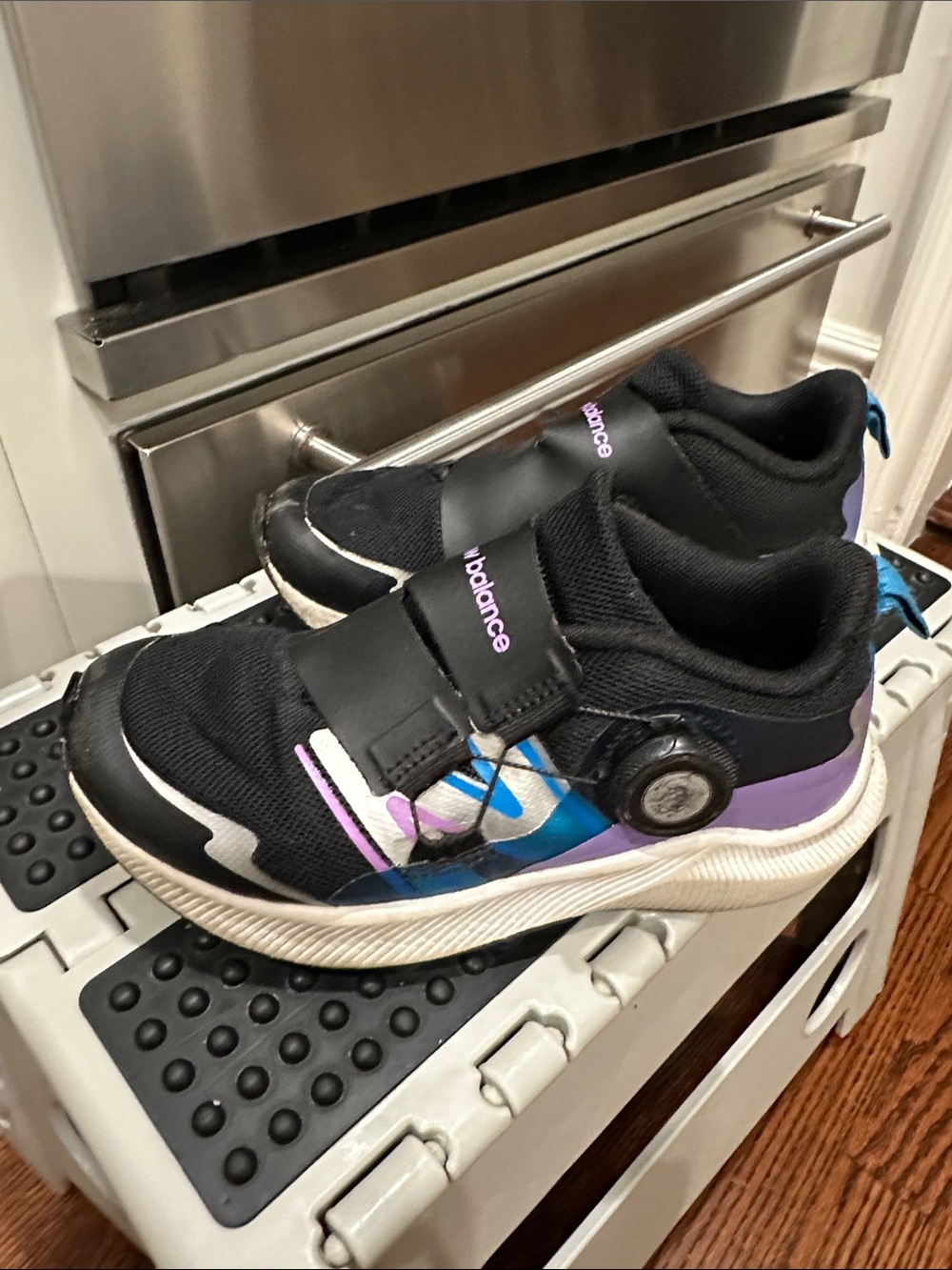 New Balance Kids Black Sneakers with Purple and Blue Accents
